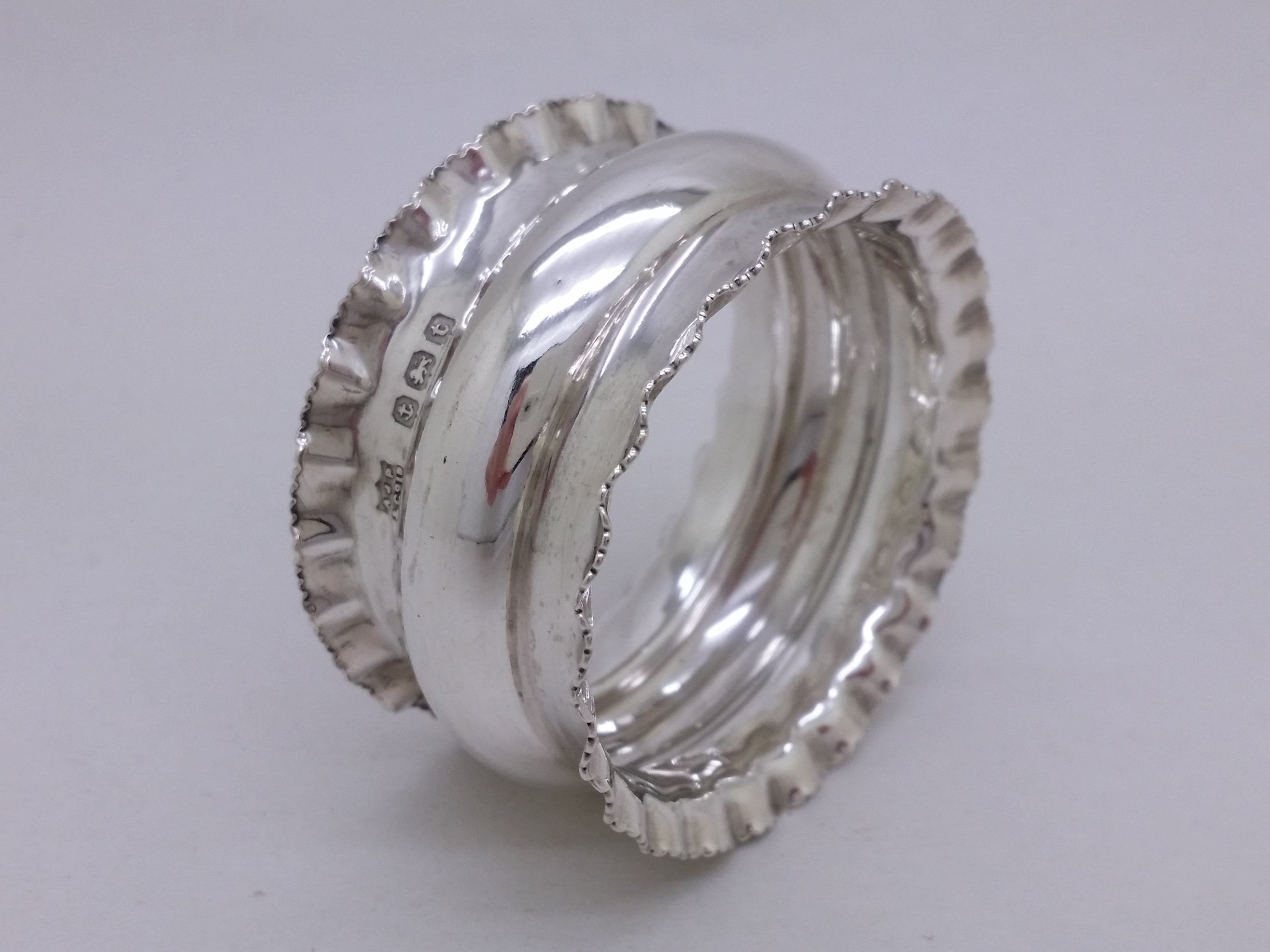 George V 1918 sterling silver crimped napkin ring, Birmingham, by A J Pepper & Co