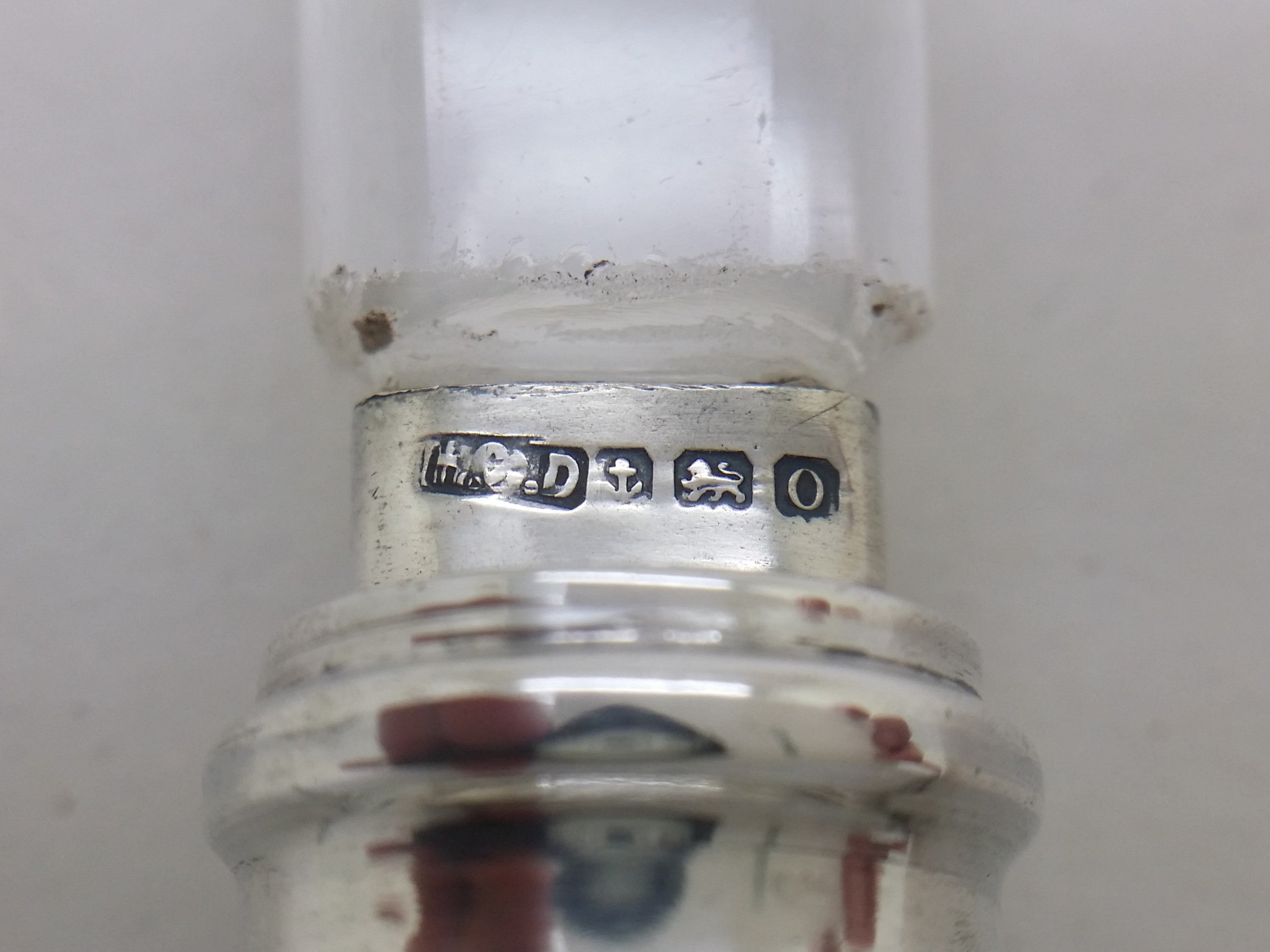 Wax seal hallmarks: Henry Clifford Davis maker's mark HCD; anchor mark for Birmingham; lion passant mark for sterling silver; and Birmingham date letter o for 1913.