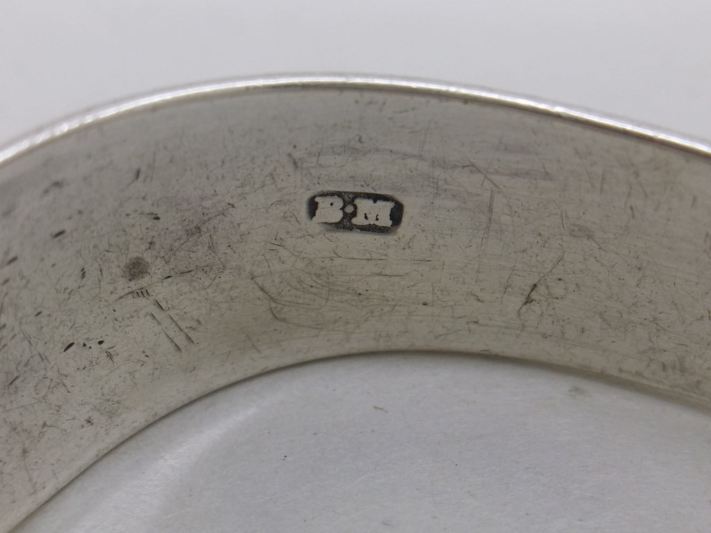 Benjamin Mountigue maker's mark BM on sterling silver sugar tongs.