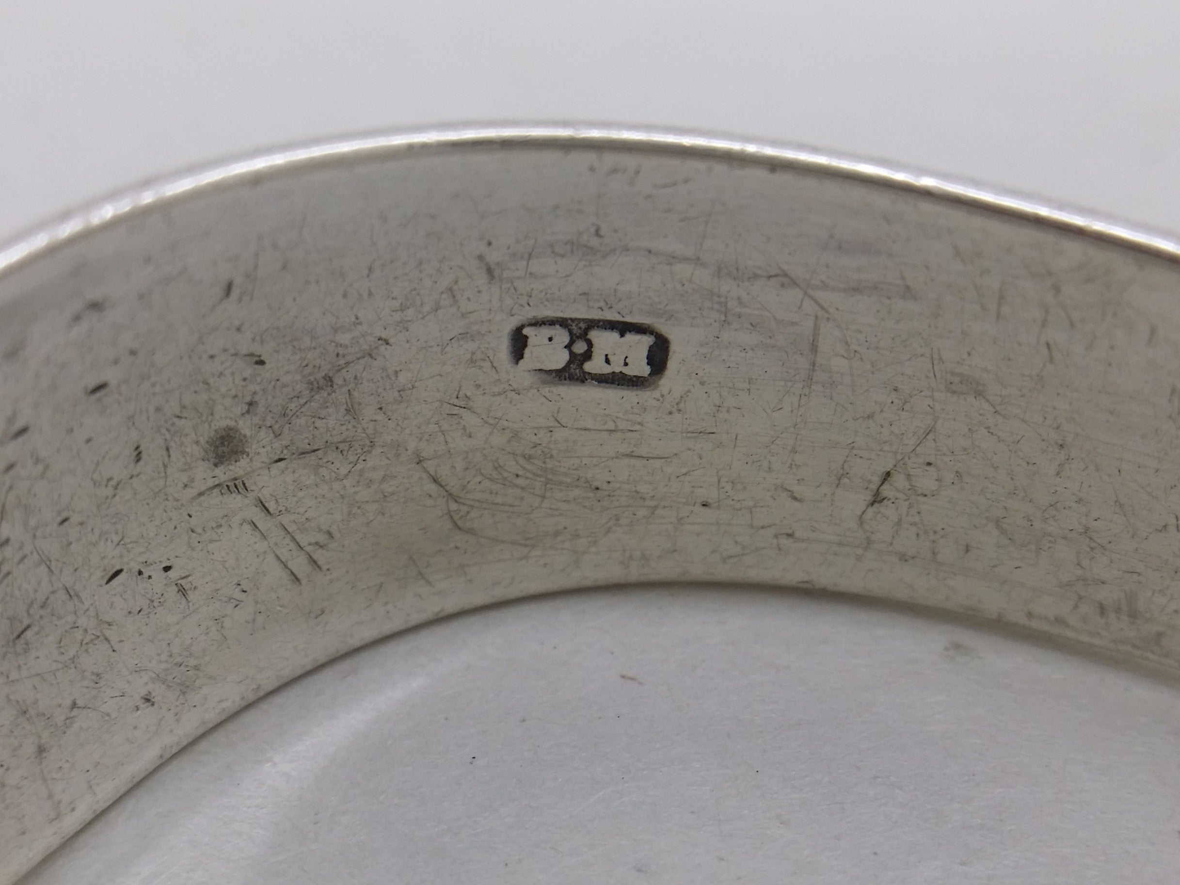 Benjamin Mountigue maker's mark BM on sterling silver sugar tongs.