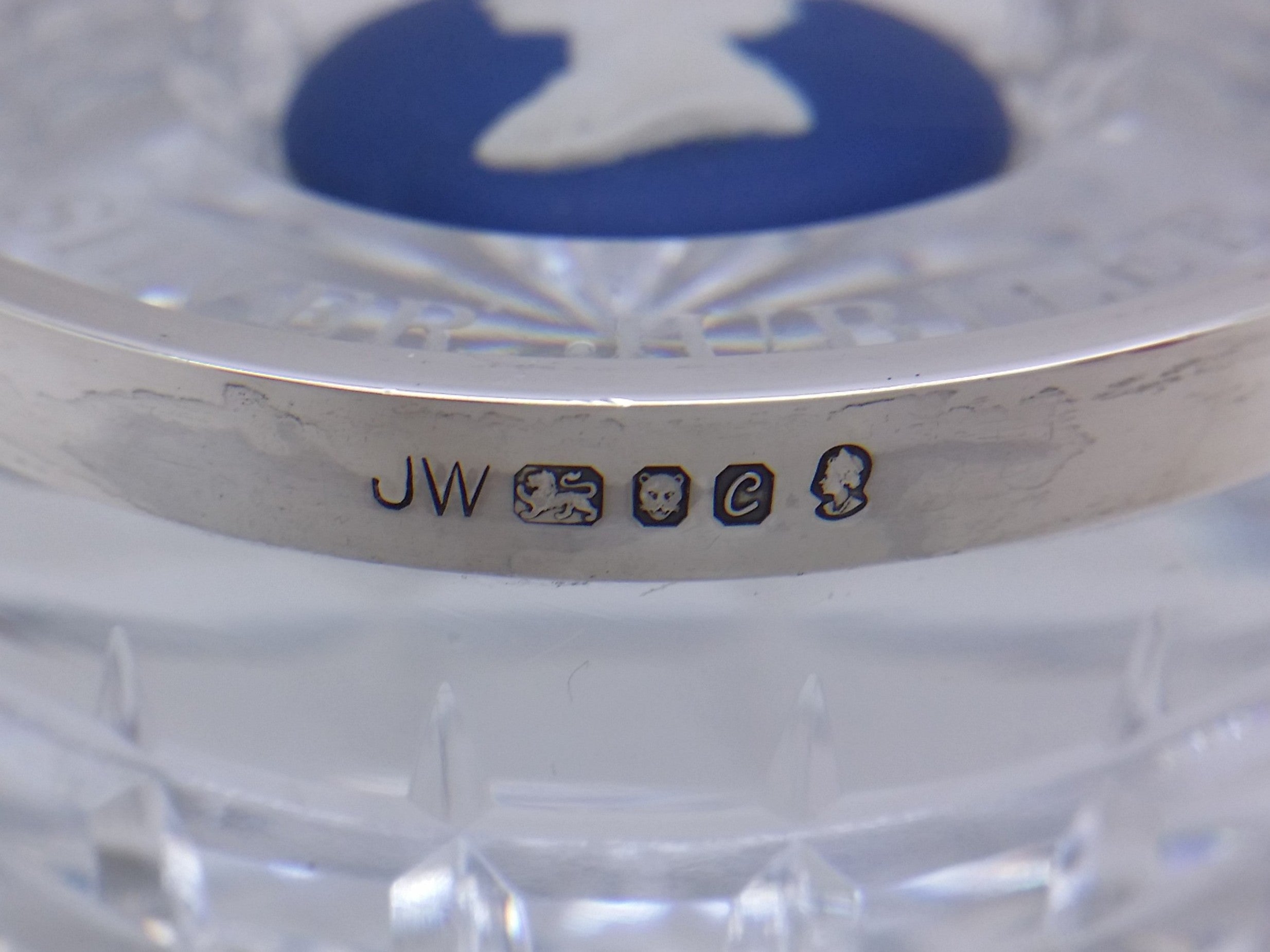 Paperweight hallmark: Josiah Wedgwood & Sons maker's mark JW; lion passant mark for sterling silver; leopard head mark for London; UK date letter C for 1977; and the commemorative Elizabeth II silver jubilee mark.