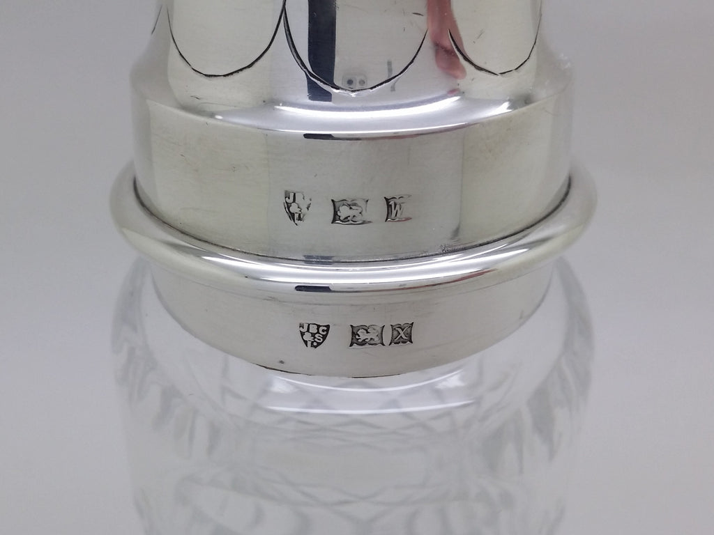 Caster lid hallmark: J B Chatterley & Sons Ltd maker's mark JBC&SLD; lion passant mark for sterling silver; Birmingham date letter W for 1971. Caster base hallmark: J B Chatterley & Sons Ltd maker's mark JBC&SLD; lion passant mark for sterling silver; Birmingham date letter X for 1972.