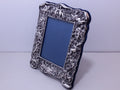 Elizabeth II 1994 britannia silver 7¼ x 5¼ cherub photo frame, London by Neil Lasher Silverware 