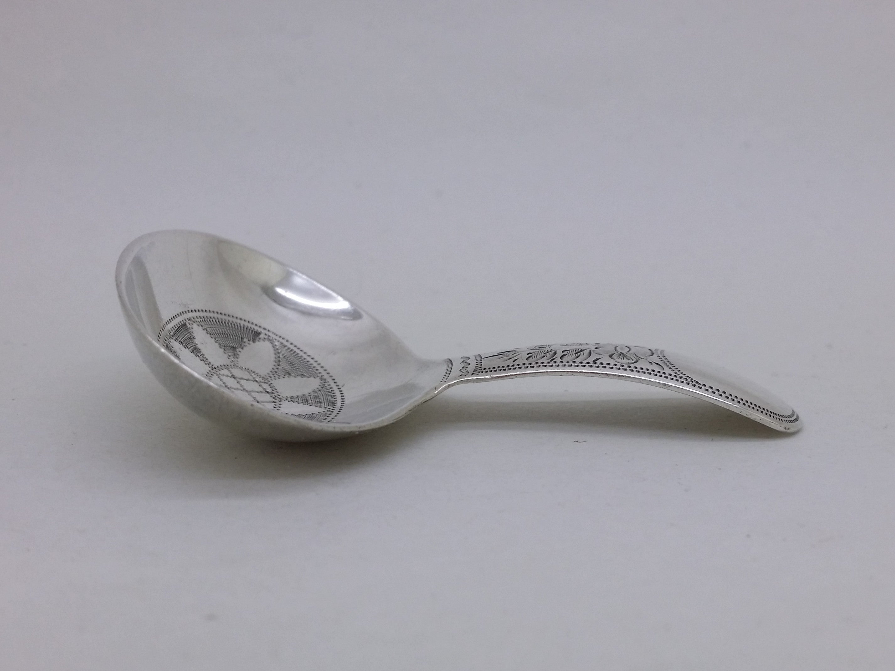 George V 1918 sterling silver floral engraved caddy spoon, Sheffield by W S Savage & Co
