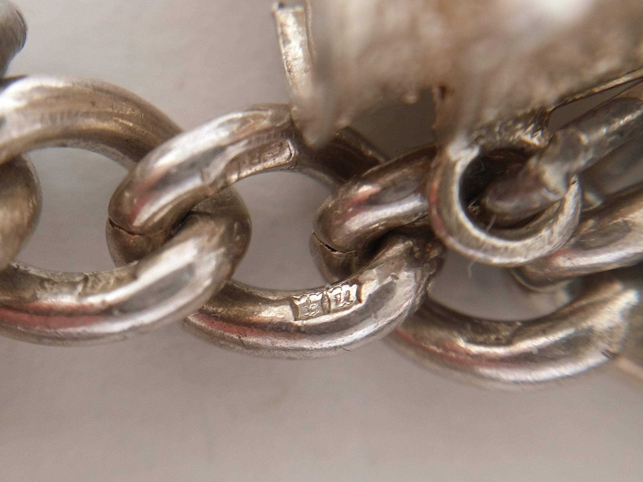 Charm bracelet link hallmarks: anchor mark for Birmingham; Birmingham date letter U for 1969.