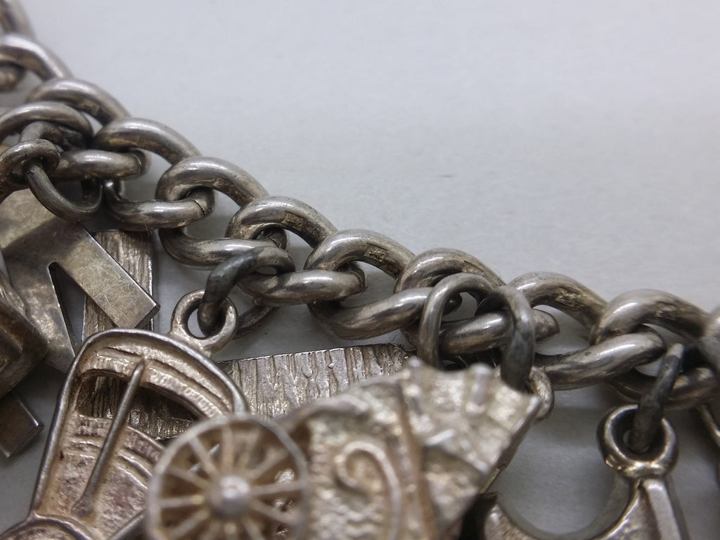 Lion passant marks on sterling silver charm bracelet links