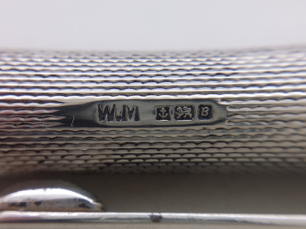 Ballpoint pen hallmarks: William Manton maker's mark WM; anchor mark for Birmingham; lion passant mark for sterling silver; and UK date letter B for 1976.