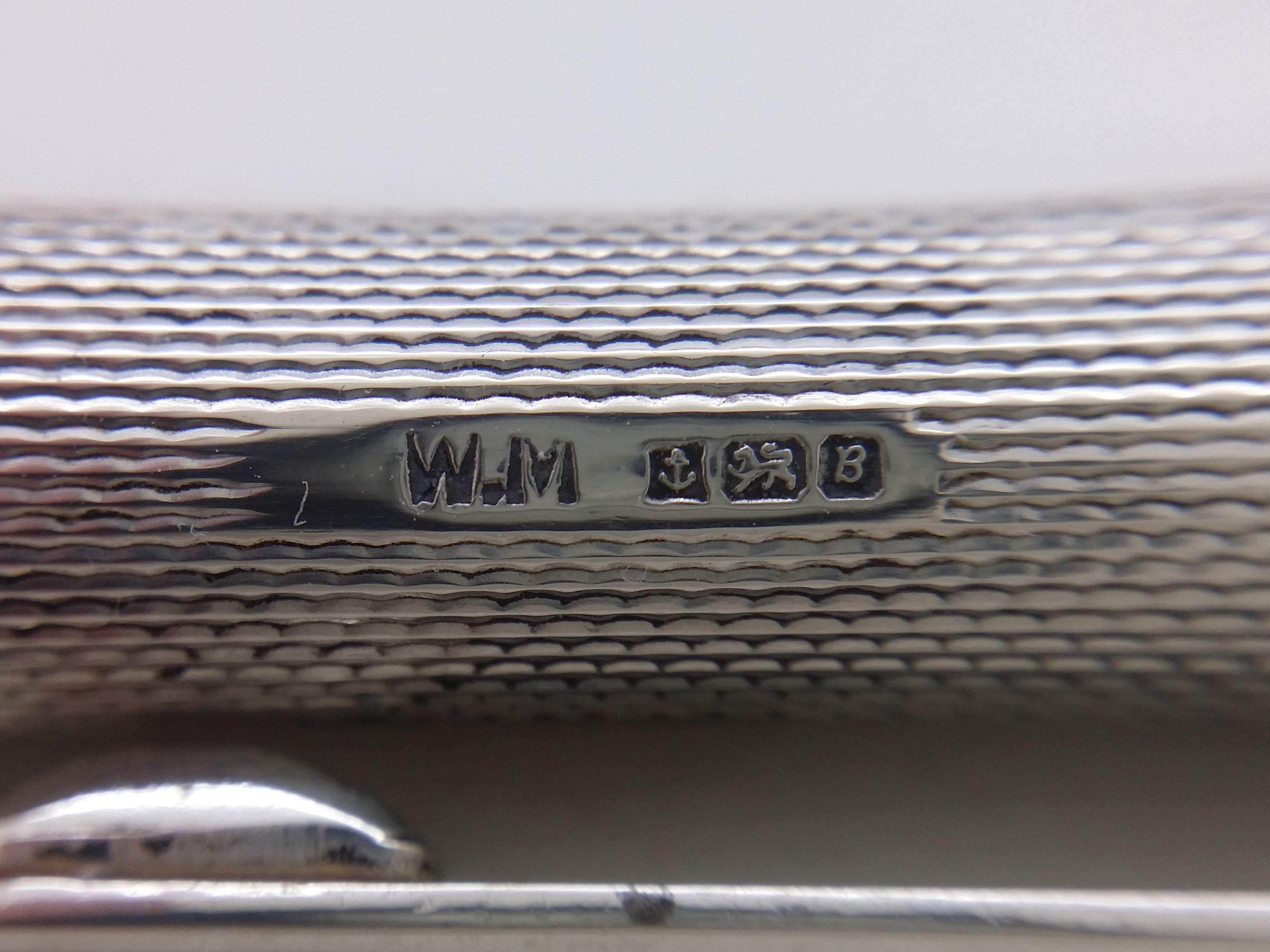 Ballpoint pen hallmarks: William Manton maker's mark WM; anchor mark for Birmingham; lion passant mark for sterling silver; and UK date letter B for 1976.