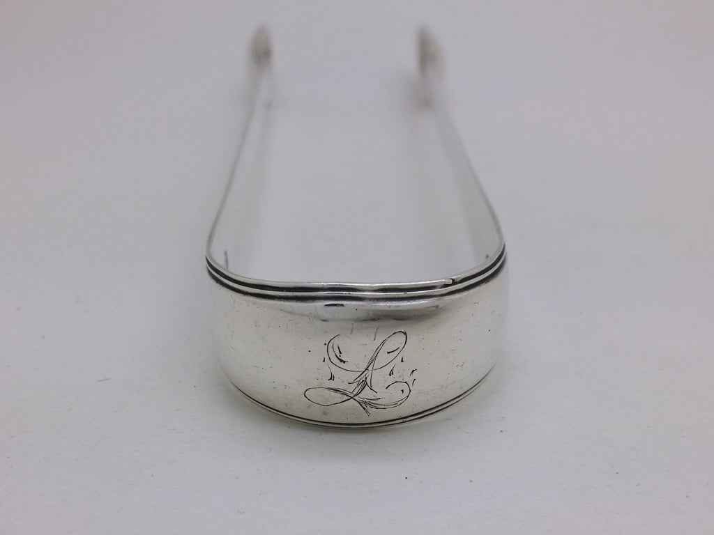 Bow of sterling silver sugar tongs with initial inscription L