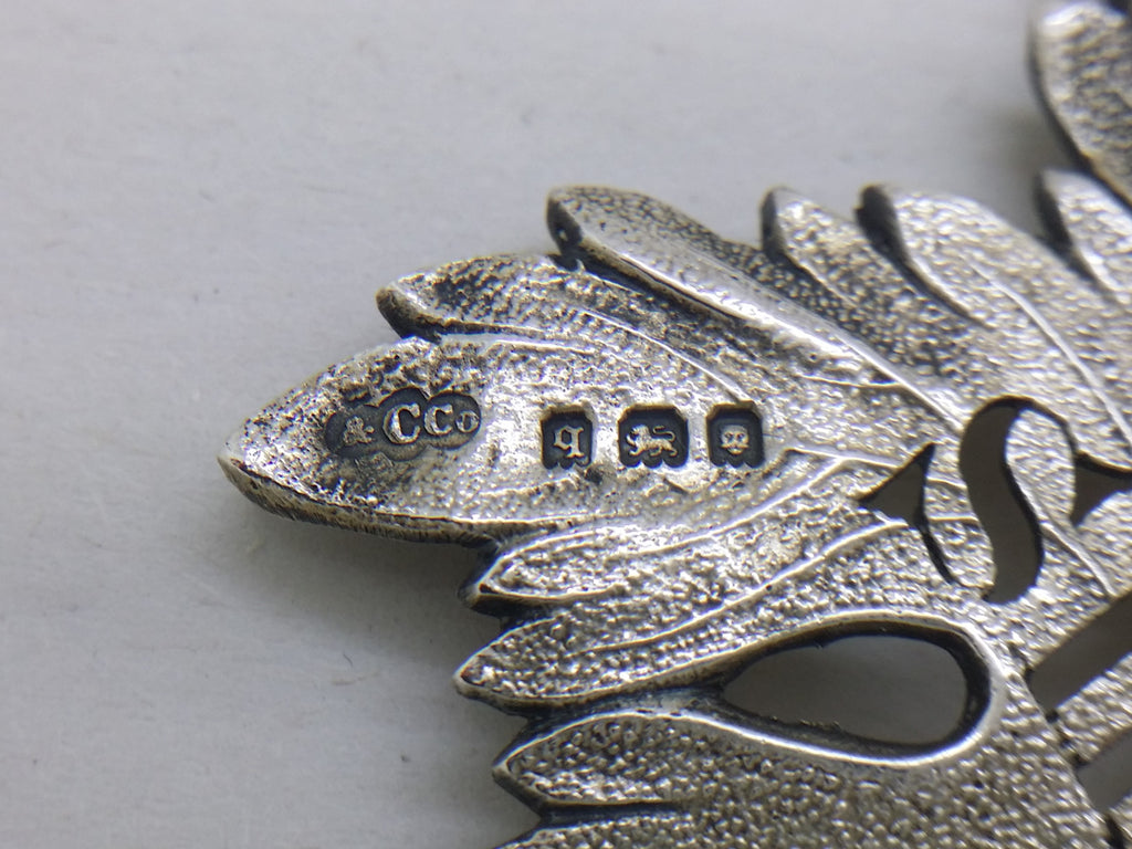 Sherry decanter label hallmarks: Collingwood & Co makers mark &CCO; London date letter q for 1931; lion passant mark for sterling silver; and leopard head mark for London.