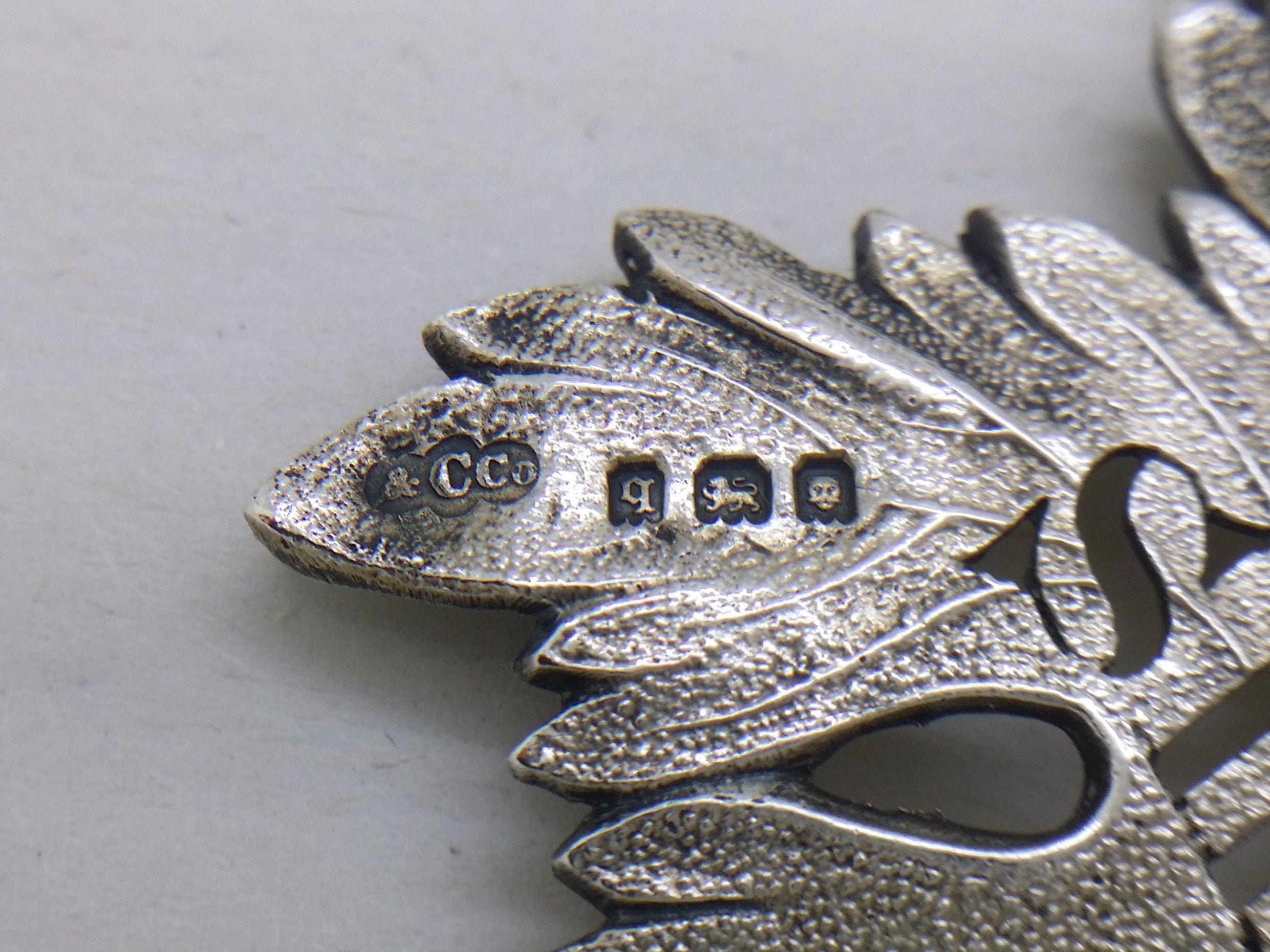Sherry decanter label hallmarks: Collingwood & Co makers mark &CCO; London date letter q for 1931; lion passant mark for sterling silver; and leopard head mark for London.