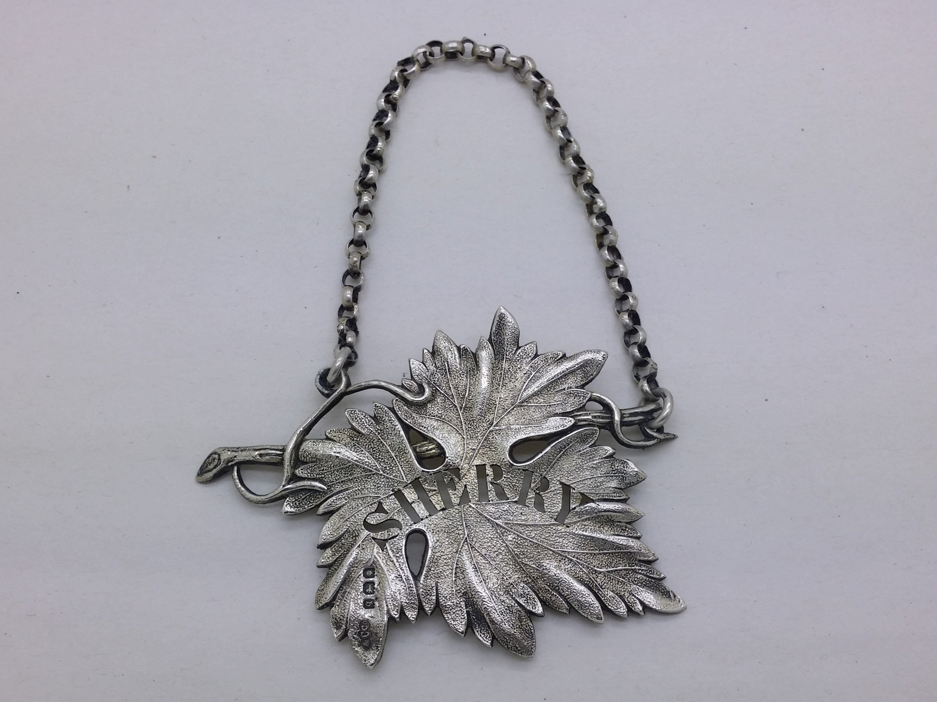 George V 1931 sterling silver vine leaf sherry decanter wine label, London by Collingwood & Co