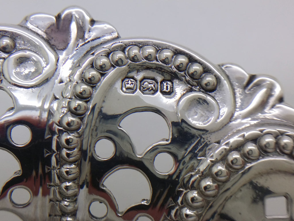 Bonbon dish hallmarks: crown mark for Sheffield; lion passant mark for sterling silver; and Sheffield date letter b for 1894.