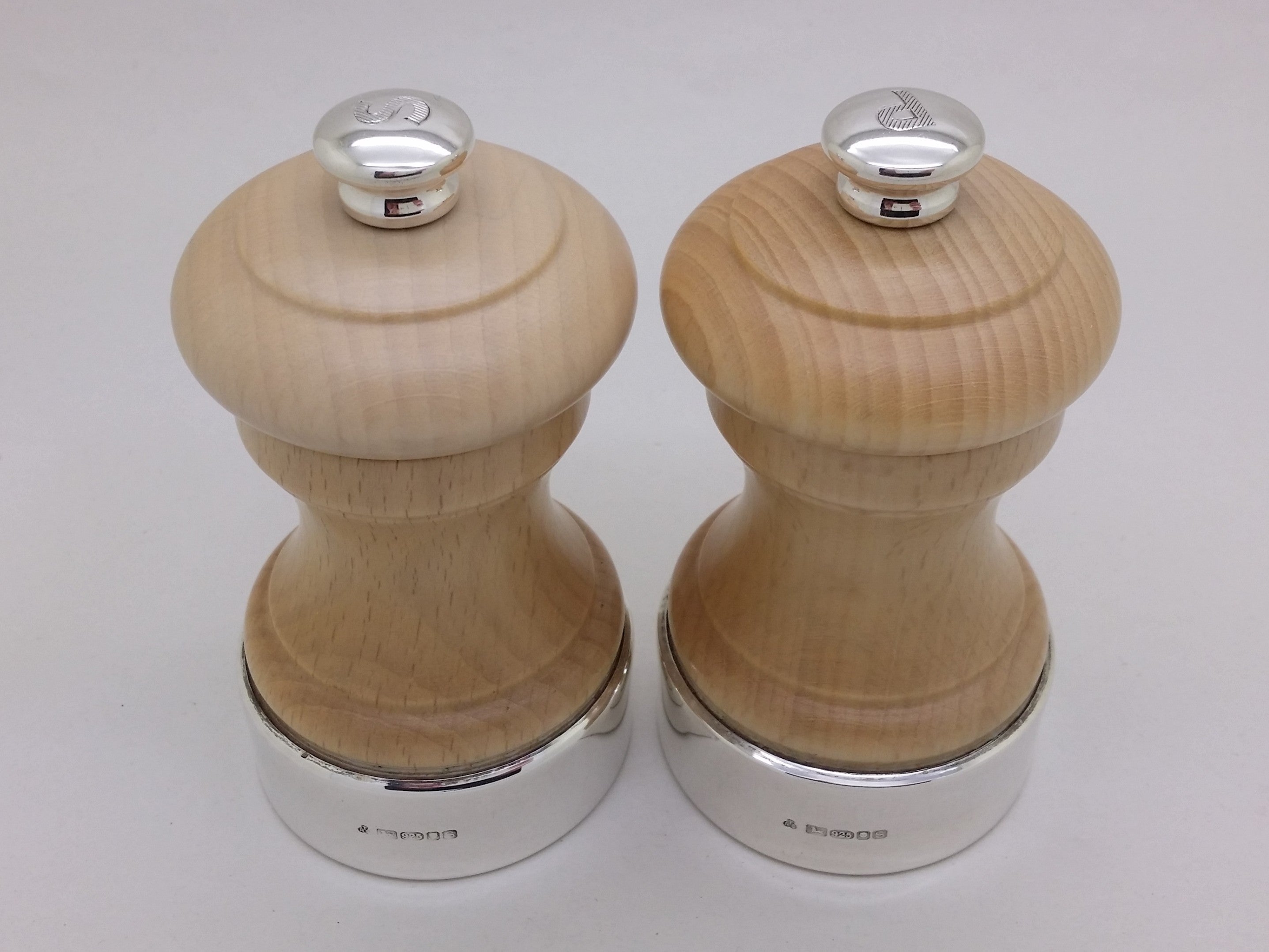 Elizabeth II 2017 pair of sterling silver mounted wooden salt & pepper mills, London by T & R Sterling Ltd