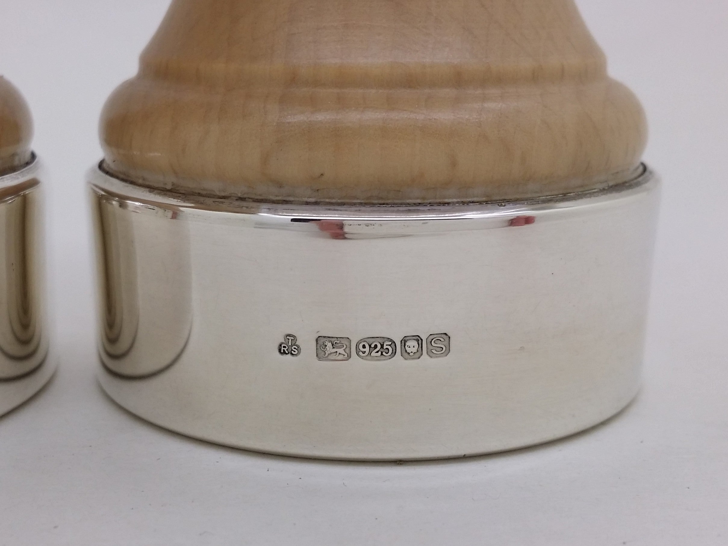 Wooden pepper mill hallmarks: T & R Sterling Ltd maker's mark TRS; lion passant mark and 925 mark for sterling silver; leopard head mark for London; and UK date letter s for 2017.