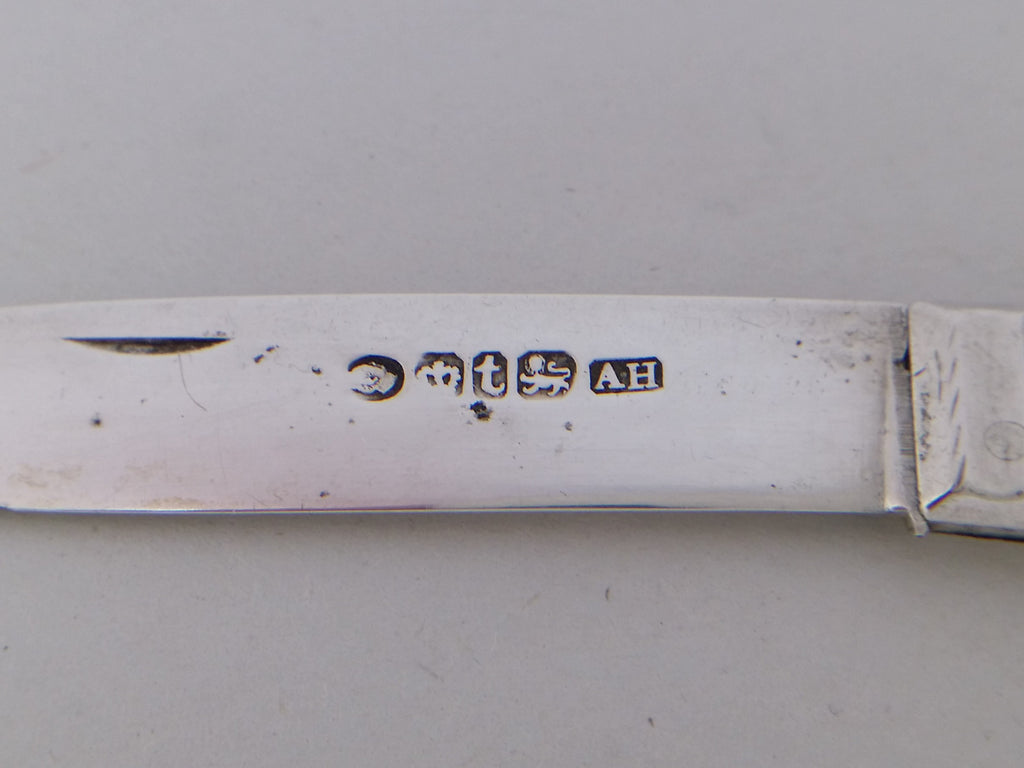 Fruit knife hallmarks: William IV duty mark; crown mark for Sheffield; Sheffield date letter t for 1839; lion passant mark for sterling silver; and Aaron Hadfield makers mark AH.
