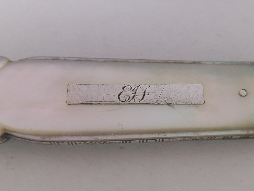 EJF or EIF initial engraved cartouche on a mother or pearl fruit knife handle