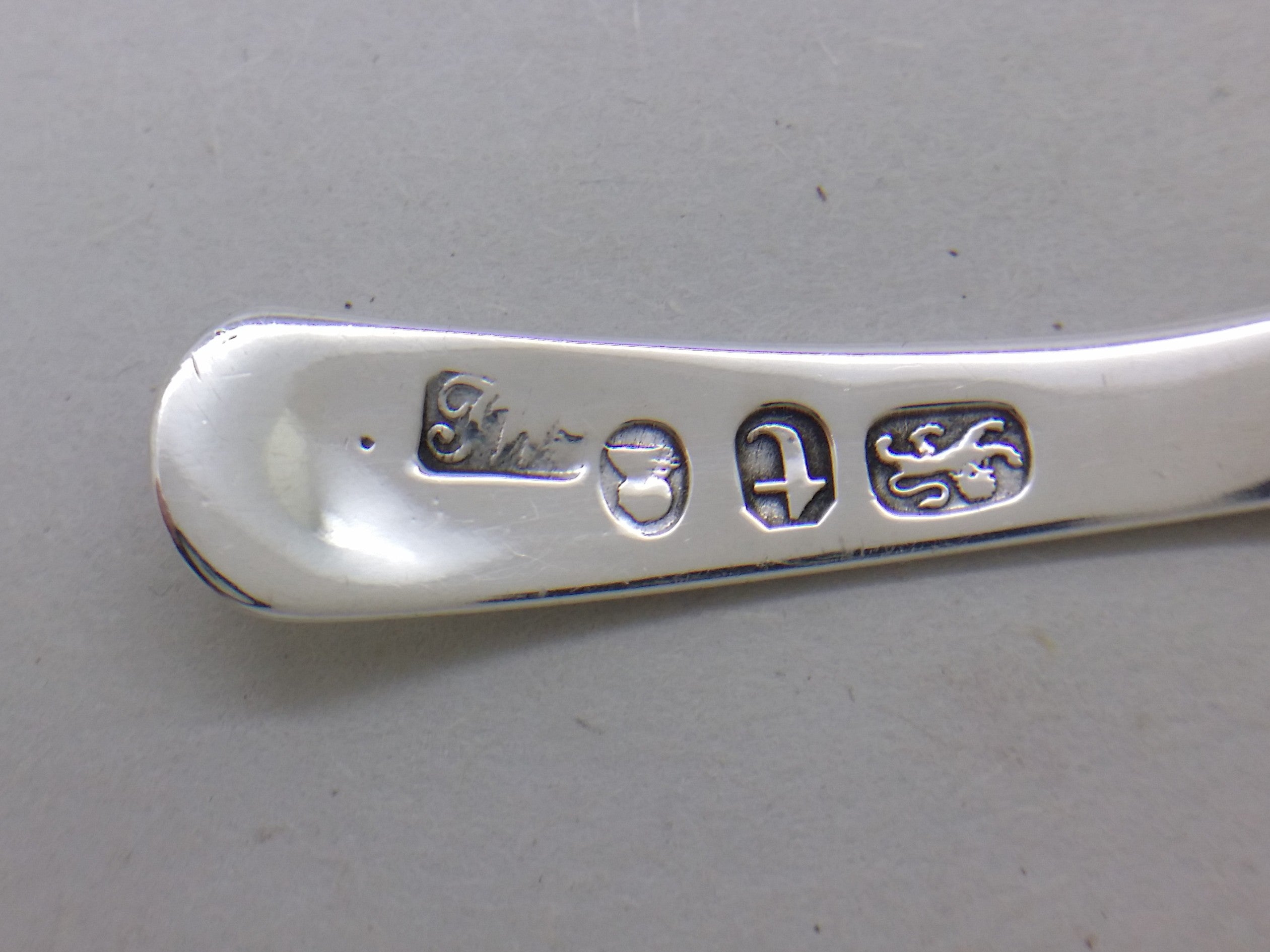 Thomas Wallis II maker's mark TW on a sterling silver caddy spoon.