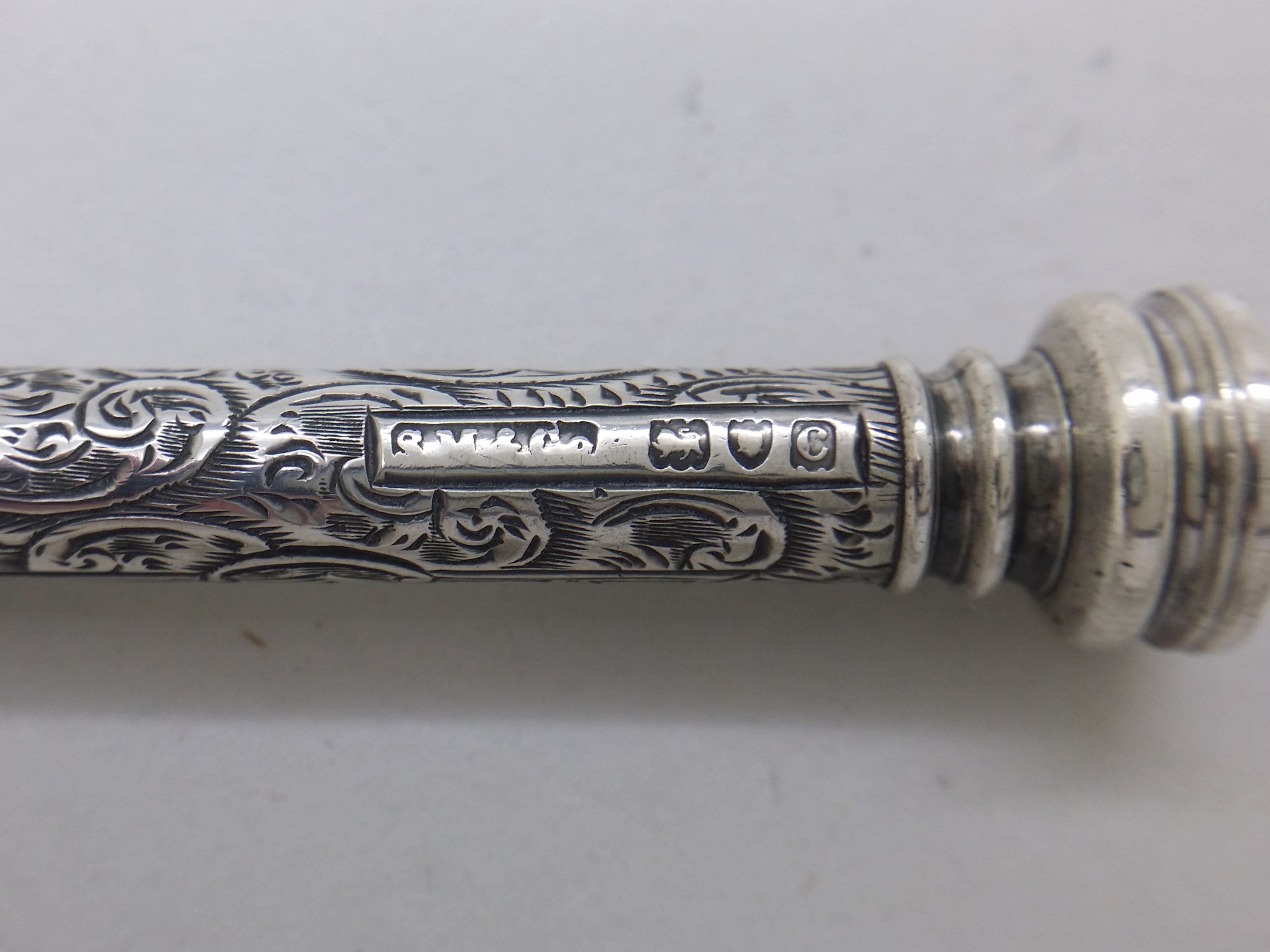 Pencil hallmarks: Sampson Mordan & Co maker's mark SM&CO; lion passant mark for sterling silver; leopard head mark for London; and London date letter c for 1898.