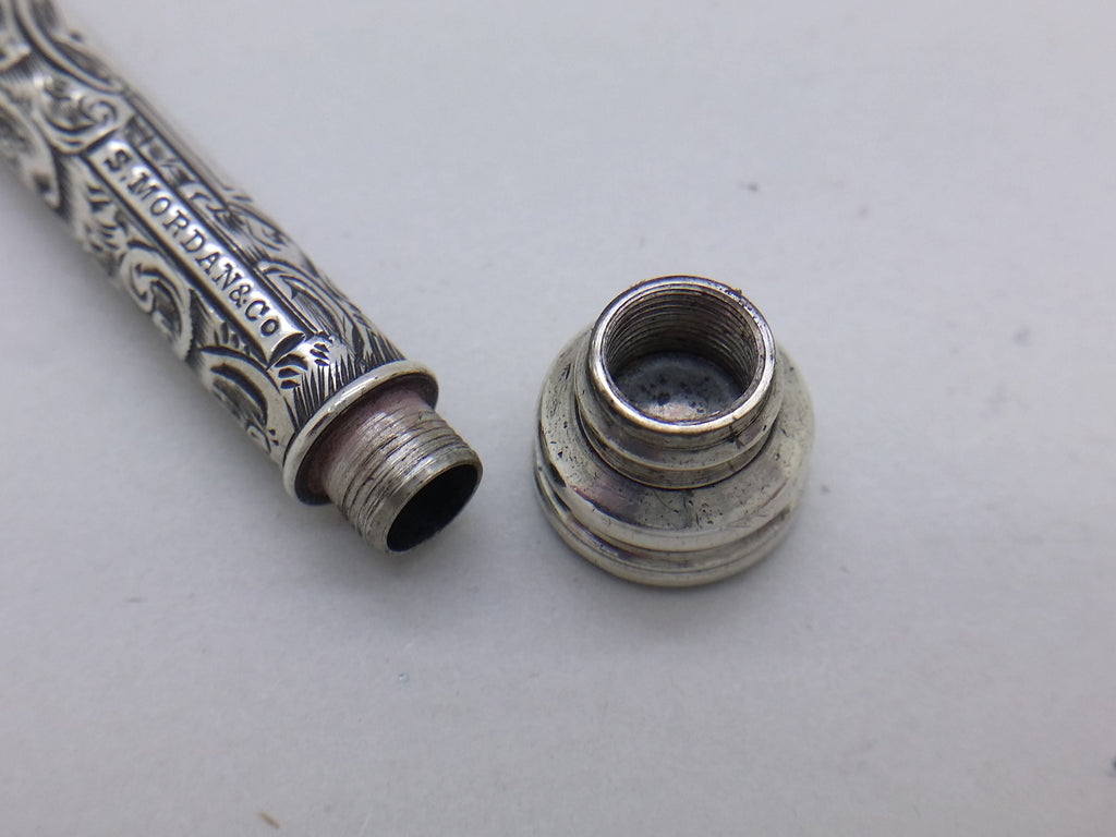 Screw-fit terminal endcap removed from Sampson Mordan propelling pencil, empty but showing where spare pencil leads would be stored.