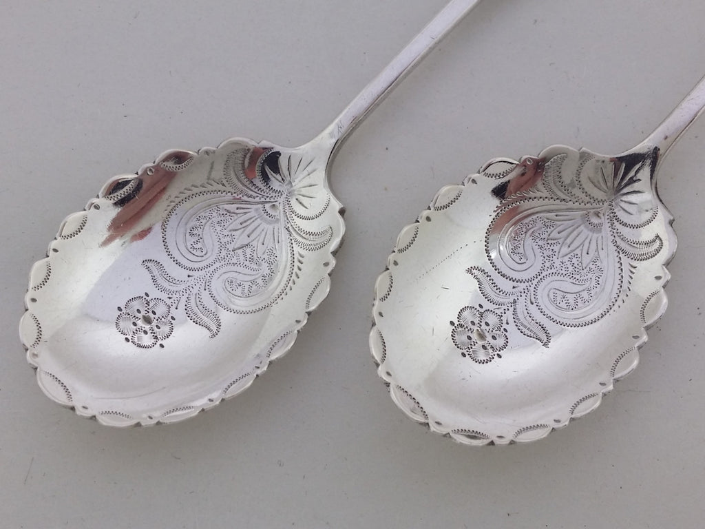 Engraved flower head designed sterling silver jam spoon bowls, with wrigglework detailing.