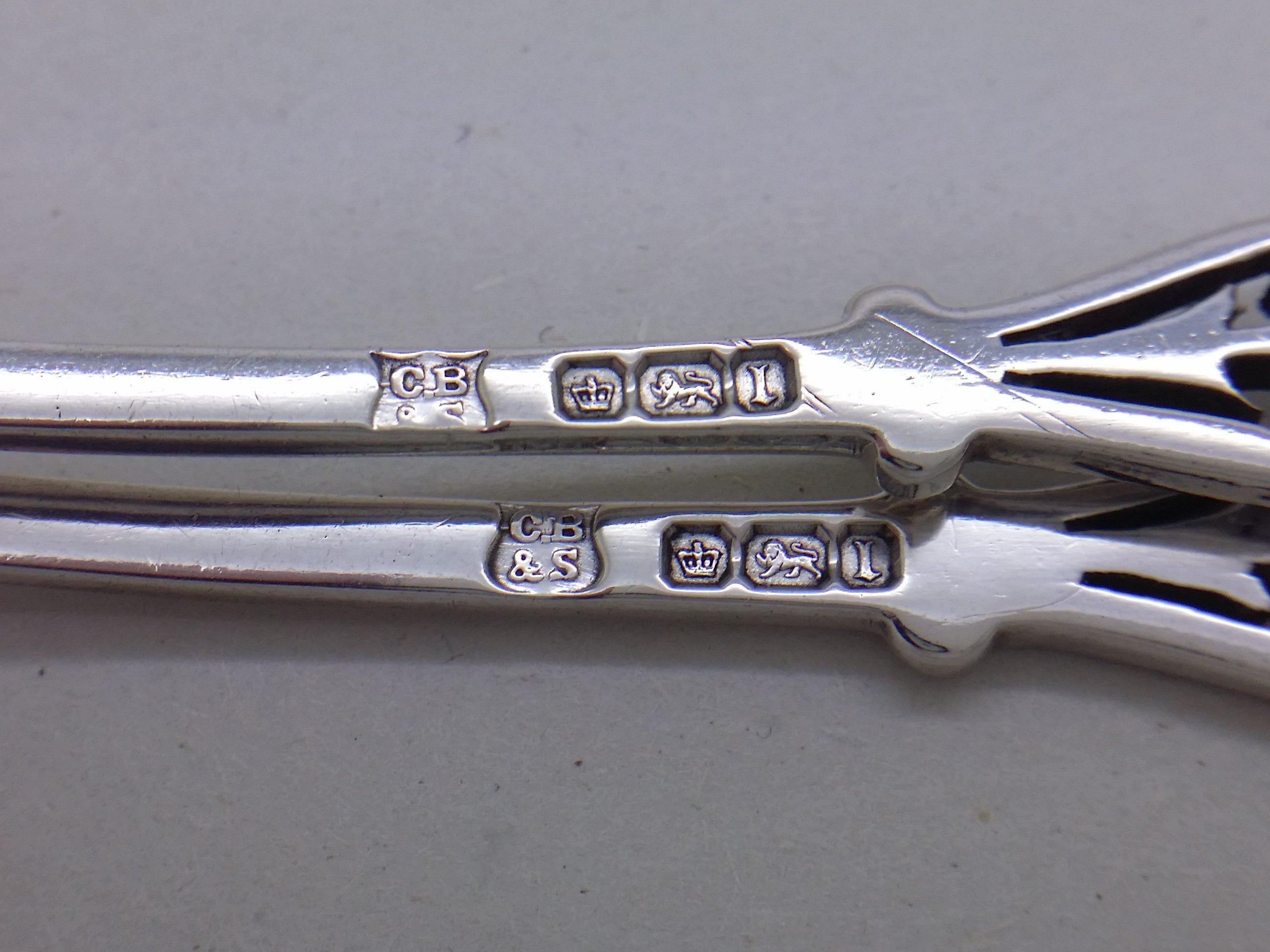 Jam spoons hallmarks: Cooper Brothers & Sons maker's mark CB&S; crown mark for Sheffield; lion passant mark for sterling silver; and Sheffield date letter l for 1903.
