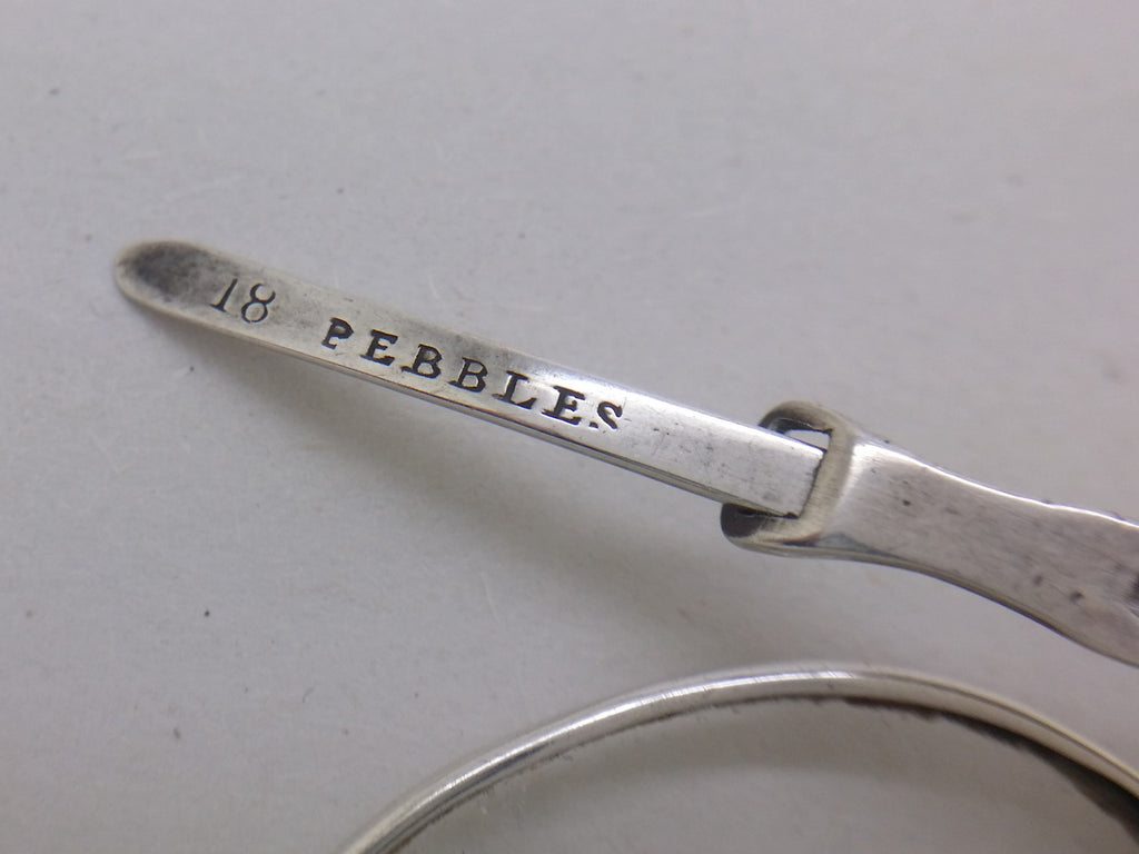 PEBBLES stamped on the arm of early Victorian spectacles, meaning they were fitted with scratch-resistant quartz crystal lenses