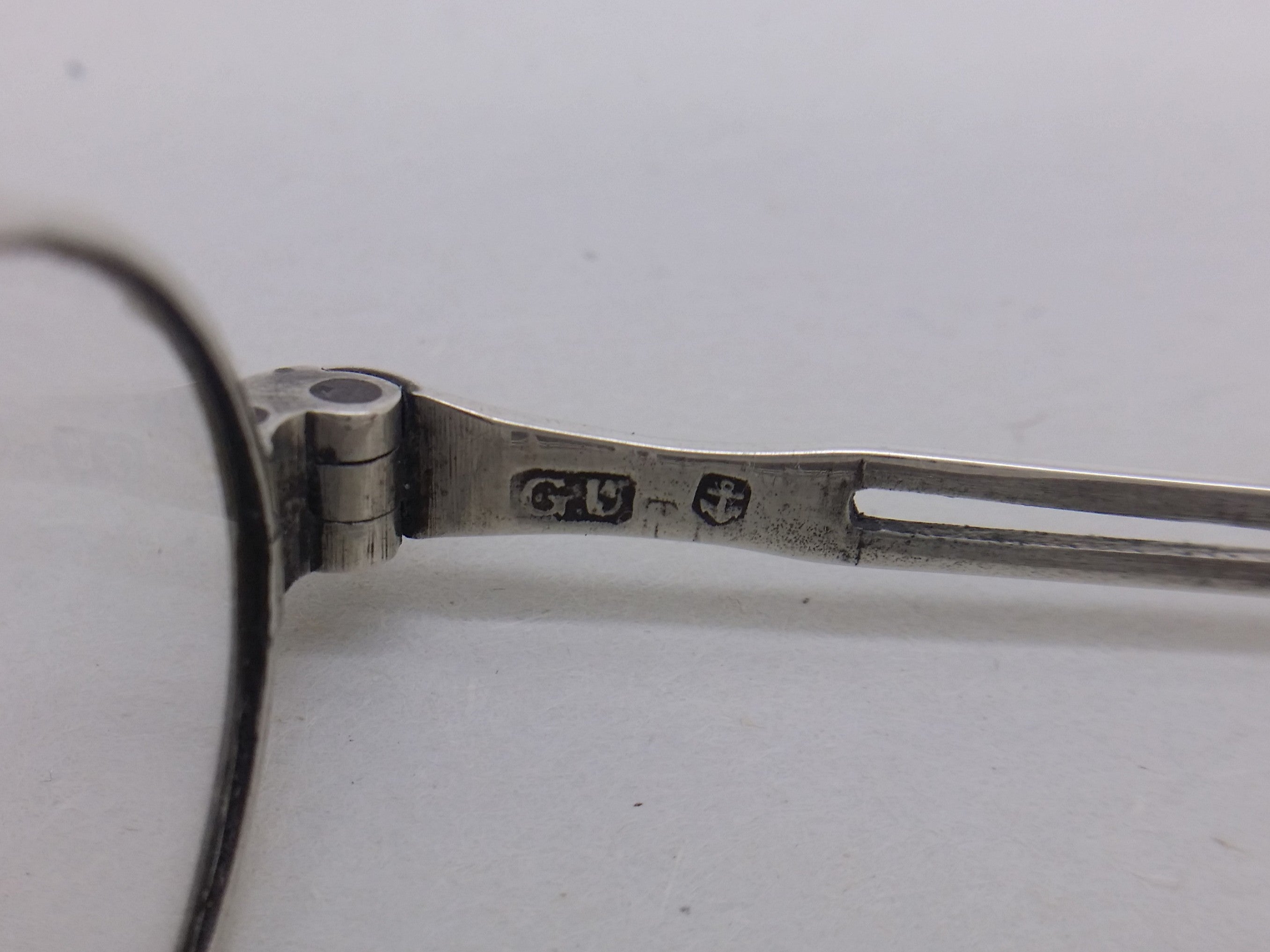 Spectacles hallmarks: George Unite makers mark GU; and anchor mark for Birmingham