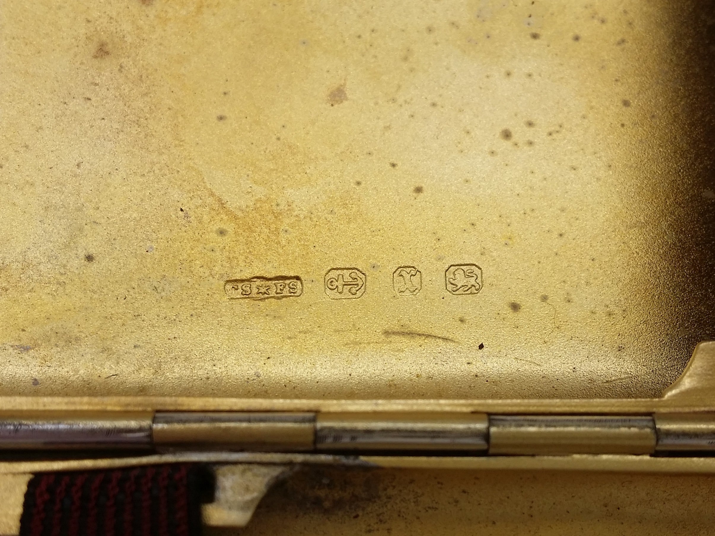 Cigarette case hallmarks: Cornelius Saunders & Francis Shepherd maker's mark CSFS; anchor mark for Birmingham; Birmingham date letter x for 1897; and lion passant mark for sterling silver.