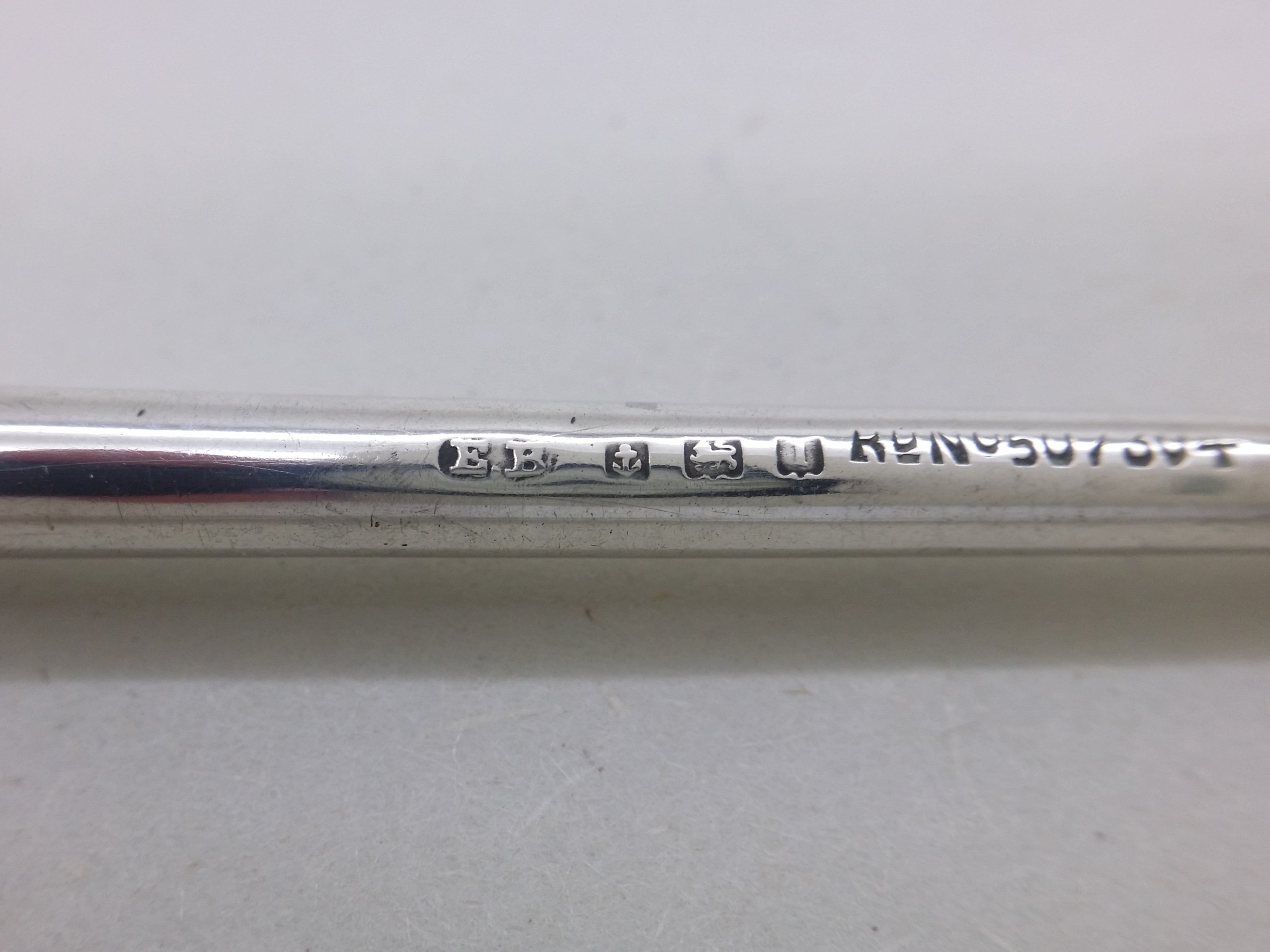Dip pen hallmarks: Edward Baker & Son maker's mark EB; anchor mark for Birmingham; lion passant mark for sterling silver; Birmingham date letter i or l for 1908 or 1910, respectively.
