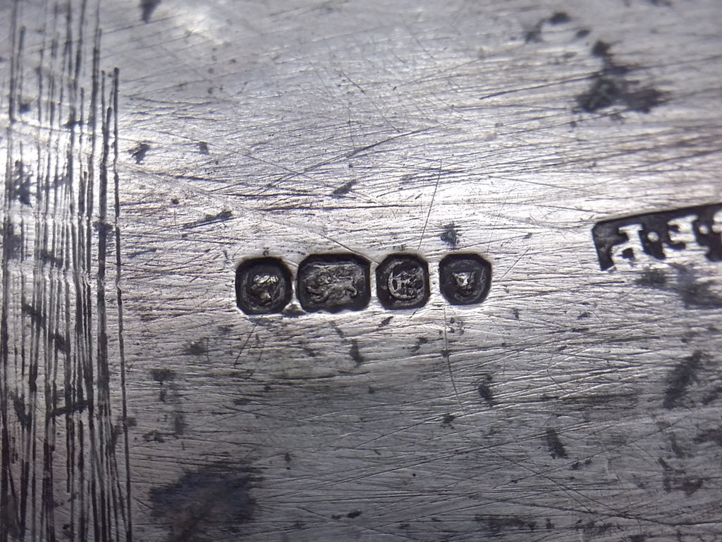 Snuff box hallmarks: Victoria duty mark; lion passant mark for sterling silver; London date letter E for 1840; and leopard head mark for London.