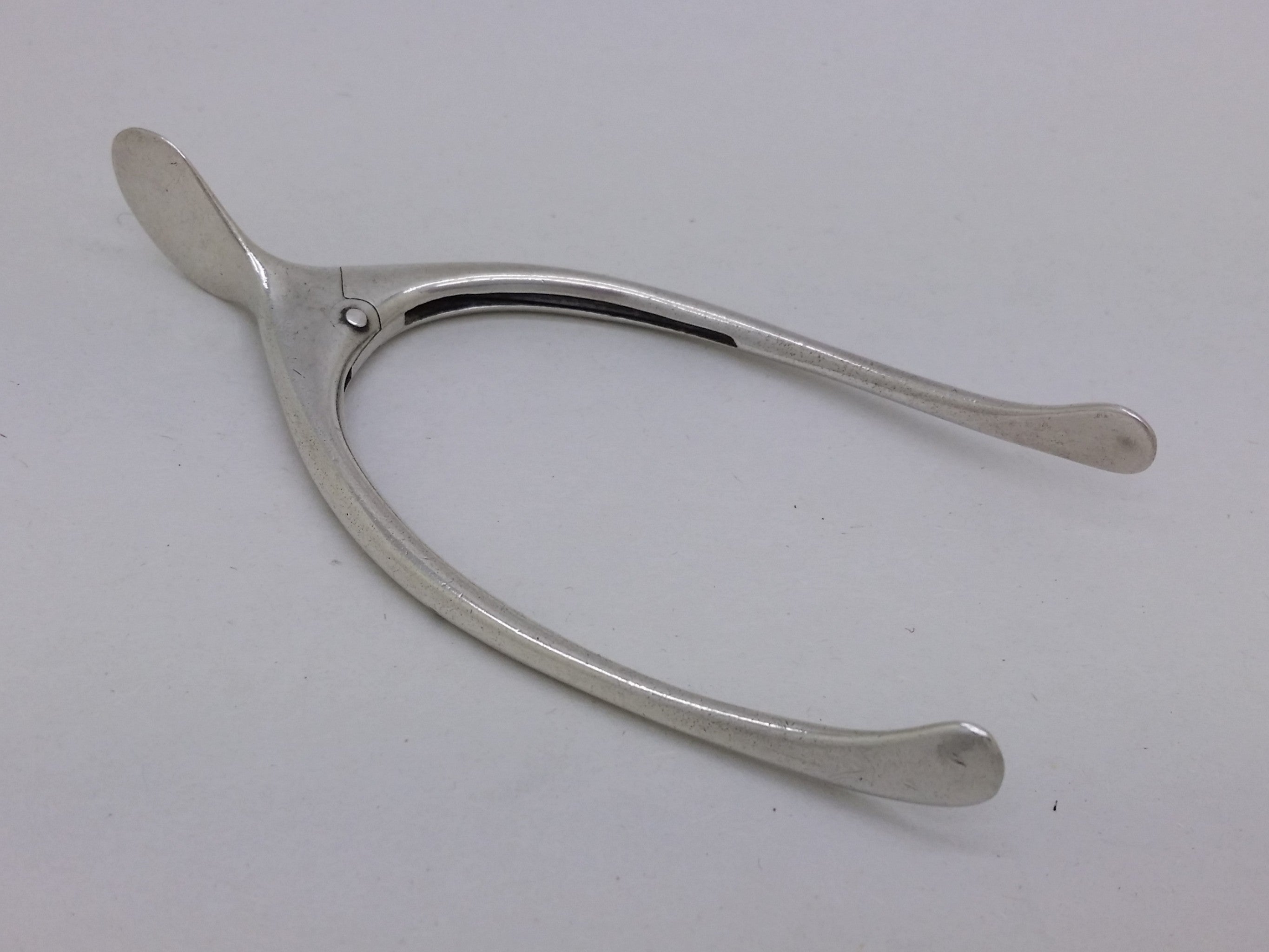 Edwardian 1901 sterling silver wishbone sugar tongs, London by Henry Stuart Brown