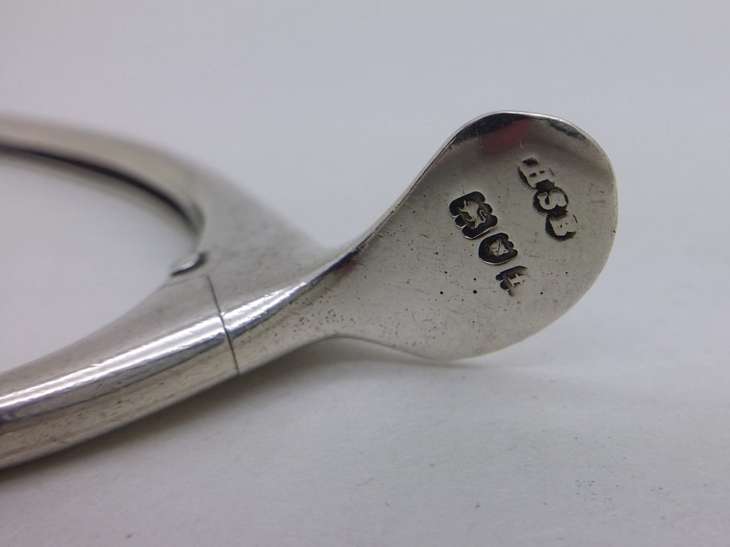 Sugar tongs hallmarks: Henry Stuart Brown makers mark HSB; lion passant mark for sterling silver; leopard head mark for London; and London date letter f for 1901.