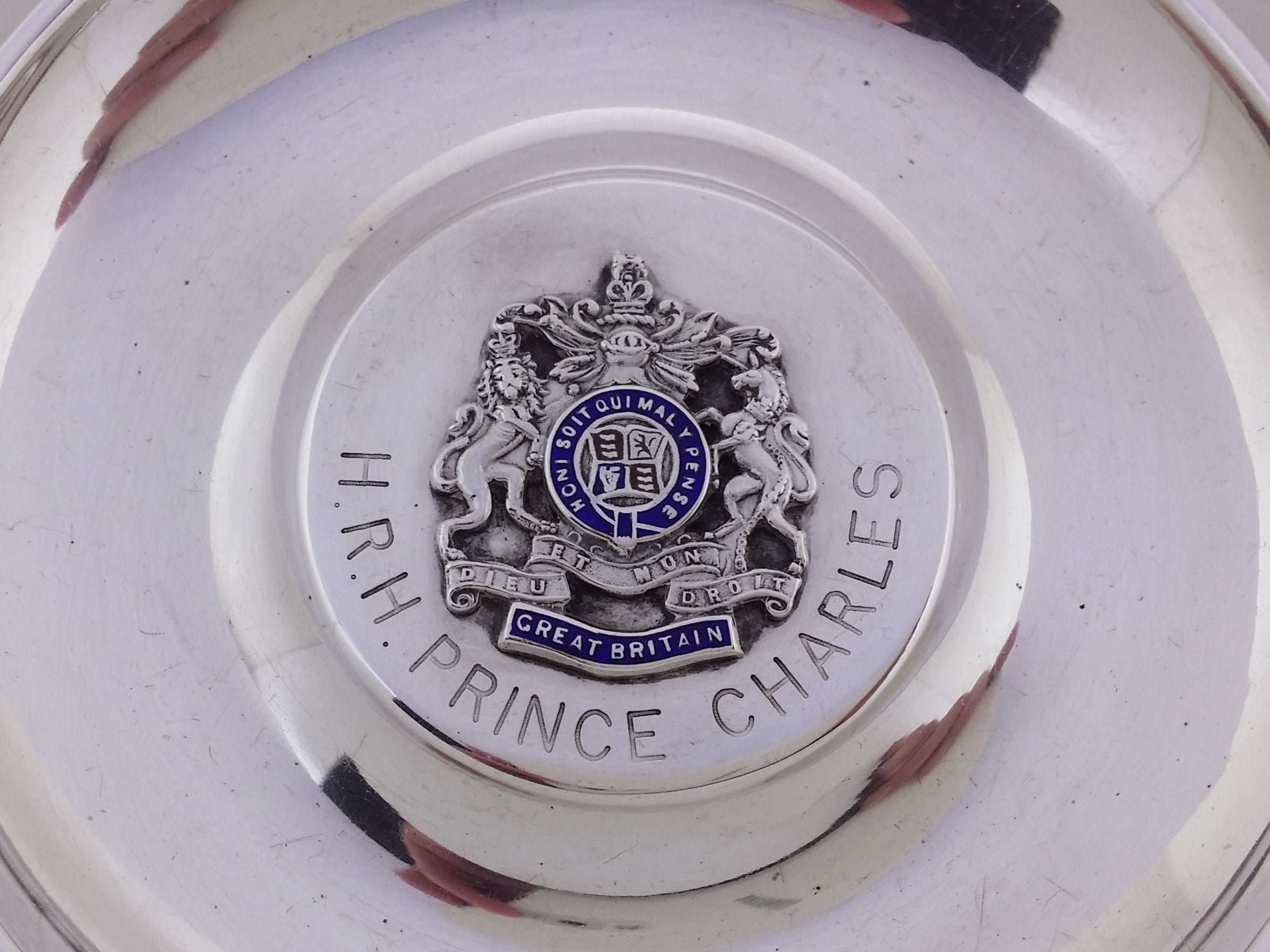 Engraved H.R.H. PRINCE CHARLES around the applied crest of the Royal coat of arms.