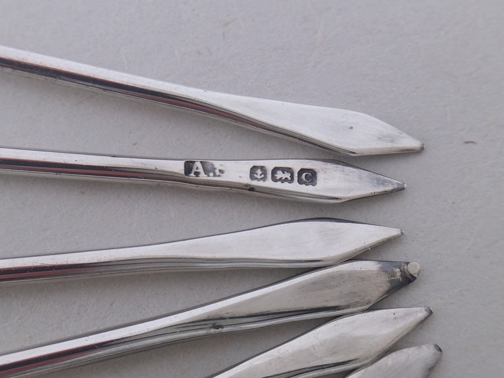 Cocktail stick hallmarks: Adolph Scott maker's mark AS; anchor mark for Birmingham; lion passant mark for sterling silver; Birmingham date letter C for 1927.
