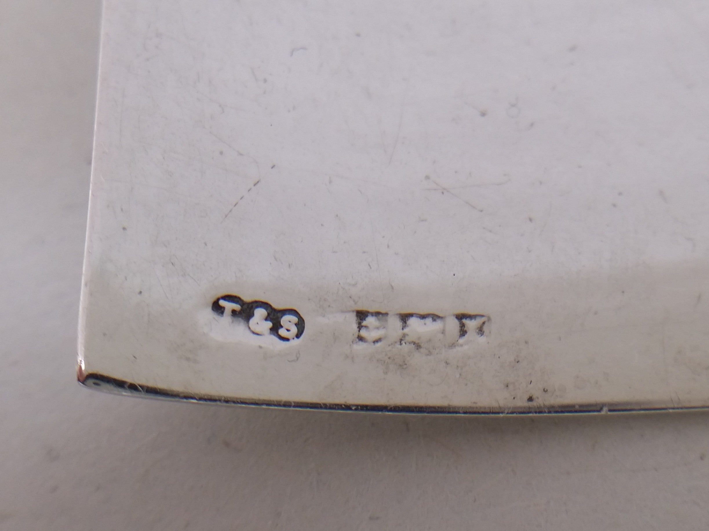 Sherry decanter label hallmarks: Turner & Simpson makers mark T&S; anchor mark for Birmingham; lion passant mark for sterling silver; Birmingham date letter X for 1972.