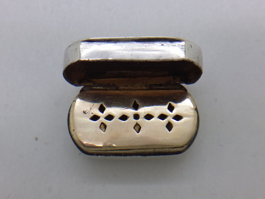 Gilded pierced hinged grill on small sterling silver vinaigrette.