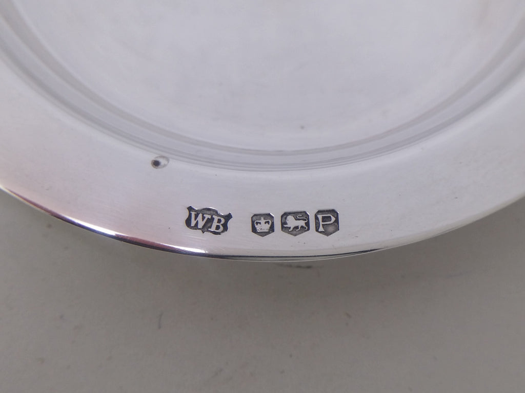Dish hallmarks: William Bush & Son maker's mark WB; crown mark for Sheffield; lion passant mark for sterling silver; Sheffield date letter P for 1957.

