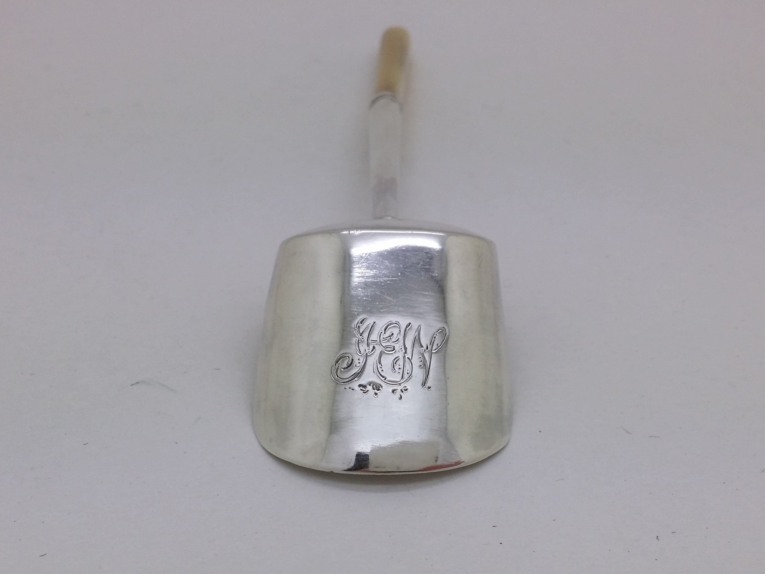 IEW initial inscription to the back of a sterling silver caddy spoon.